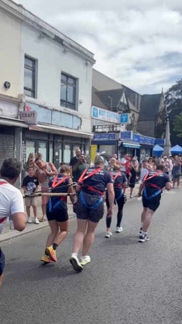 Volunteers continue the truck pull through Bexleyheath