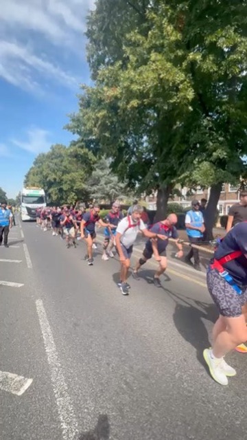 Volunteers begin the truck pull from Welling
